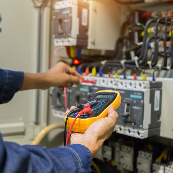 electrician inspecting circuit breaker